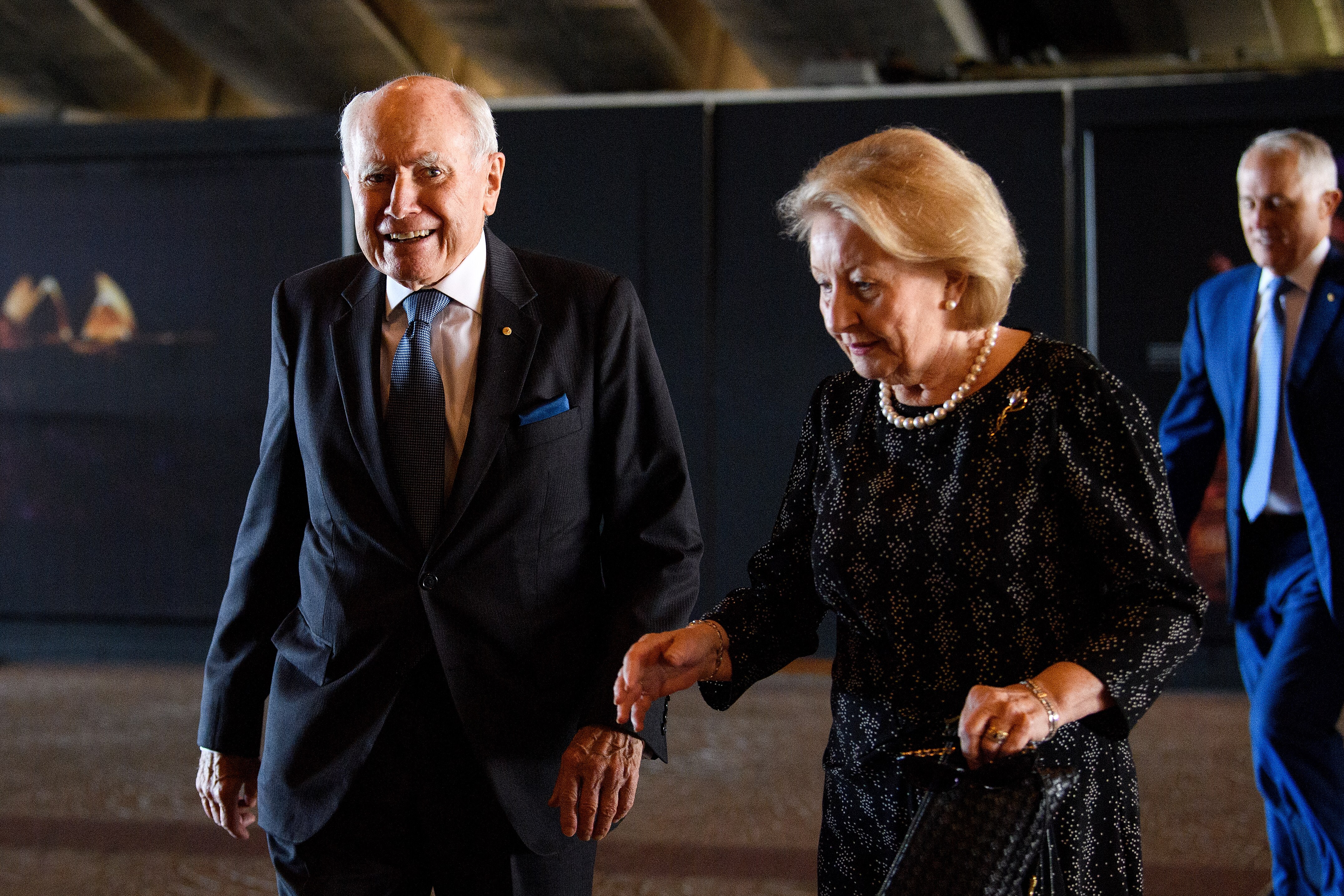 An older man with his wife.