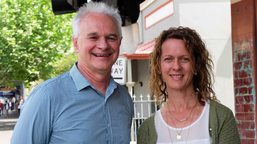 Sydney school chaplains Rob Hodgson and Megan Harris stand on street.