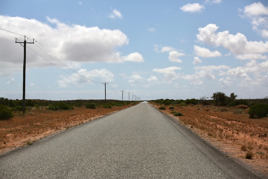 A deserted road in regional Australia stretching into the distance