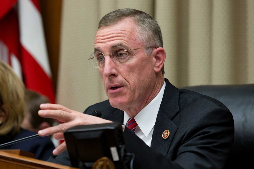 Tim Murphy wears a suit and tie as he speaks in Congress.