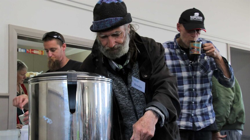 Men making themselves a hot drink in the Peel Community Kitchen.