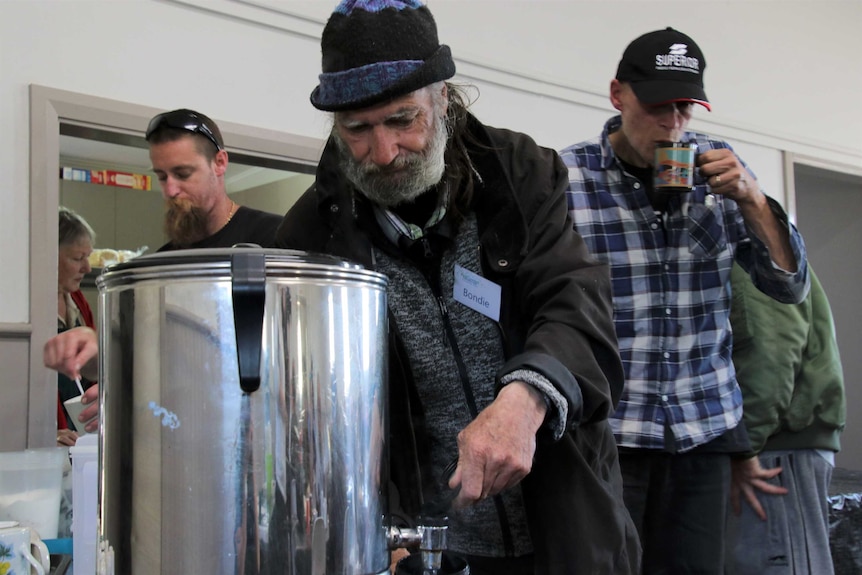 Men making themselves a hot drink in the Peel Community Kitchen.