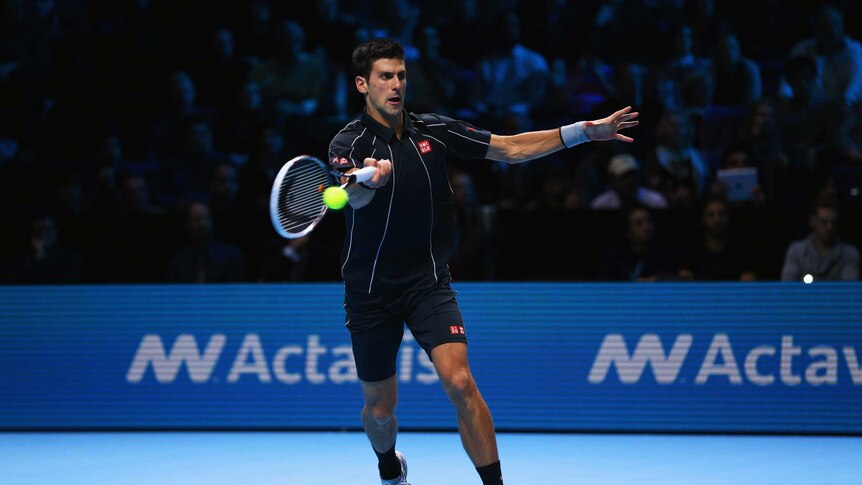 Serbia's Novak Djokovic hits a forehand against Roger Federer at the World Tour Finals in London.