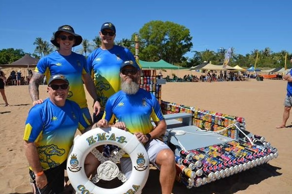 Regatta winning crew Junior Balk stand next to their creation.