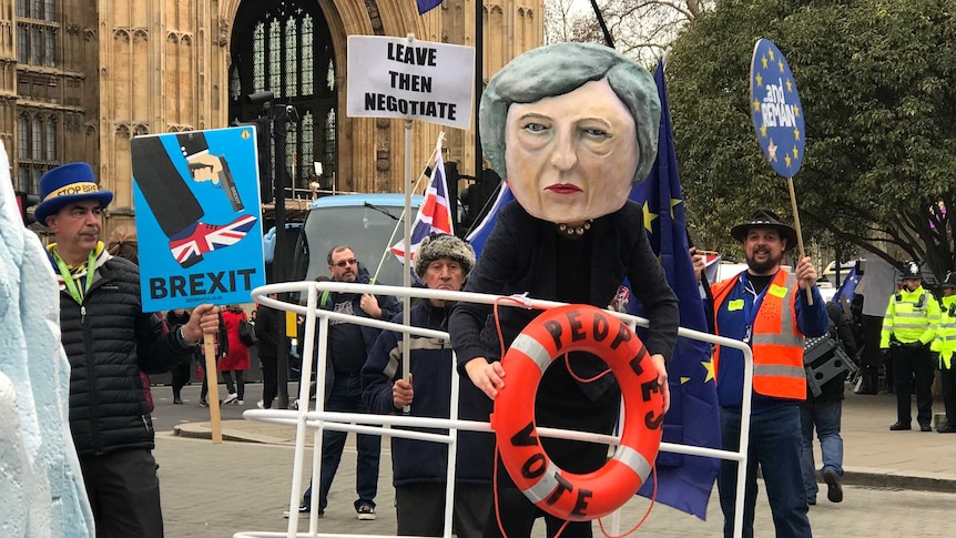 A protester dressed as Theresa May outside of Westminster