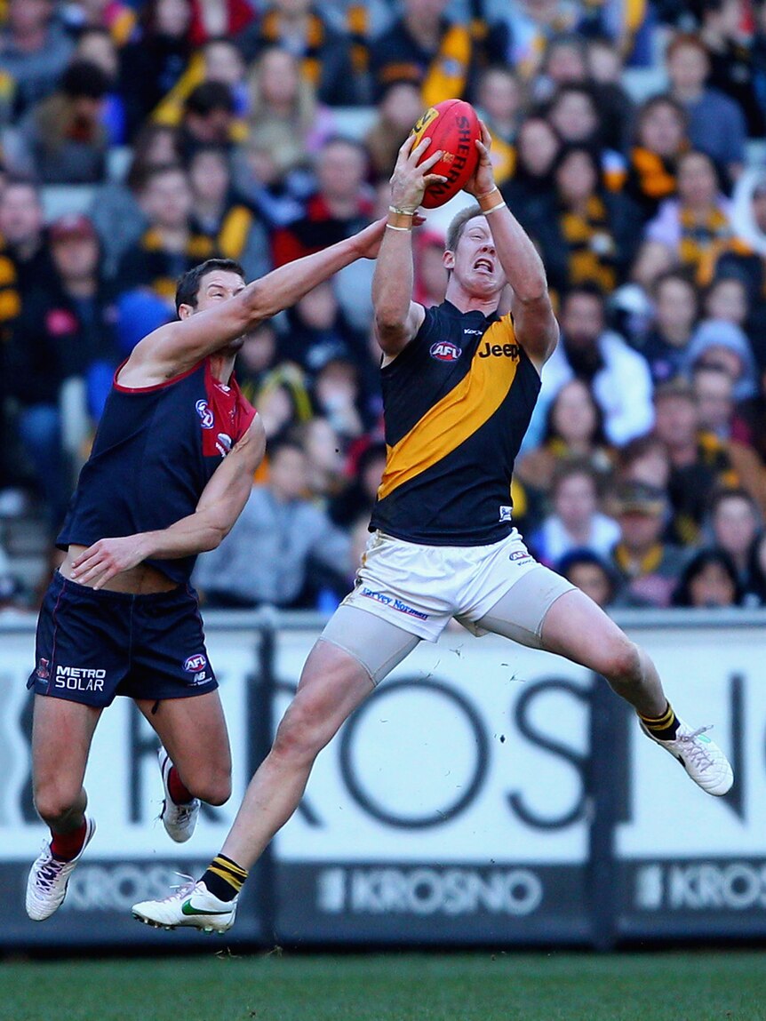 The Tigers' Jack Riewoldt takes a mark against Melbourne at the MCG.