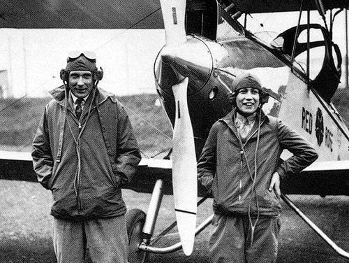 Pilot Jessie Maude Miller in front of an aeroplane.