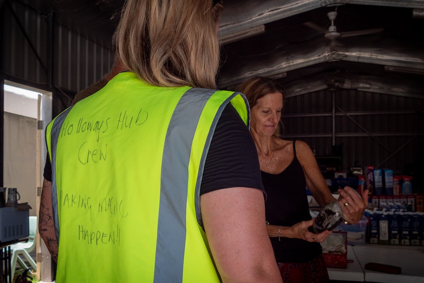 yellow high-vis vest with hand-written message saying 'making magic happen'