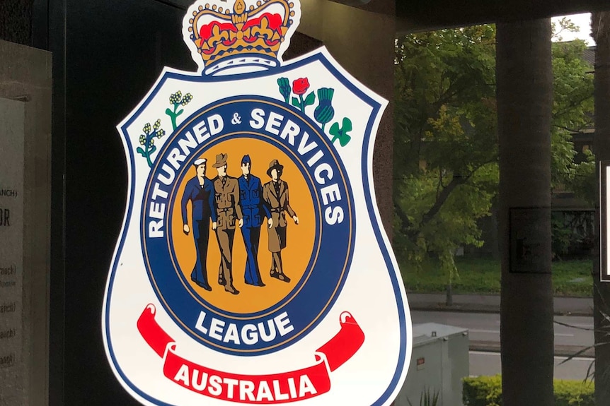 Returned & Services League Australia logo on the front doors of the RSL Queensland offices in Brisbane.