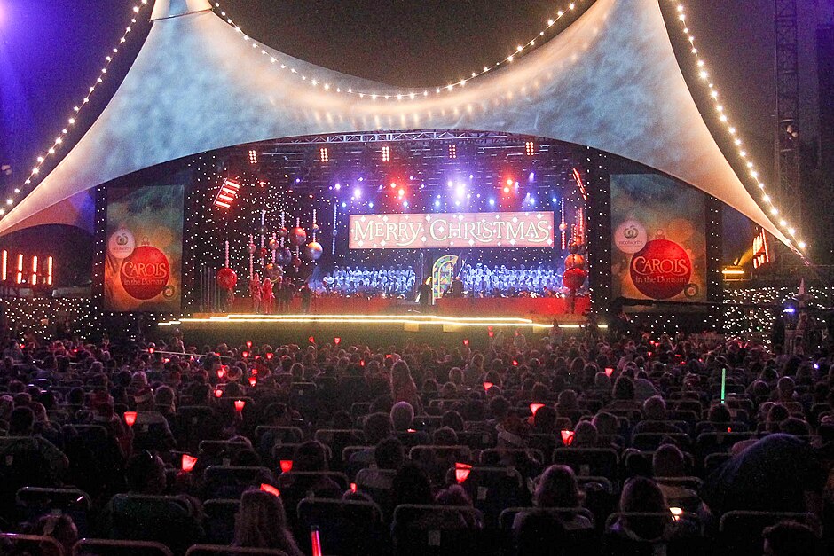 Crowd watches Christmas Carols in the Domain
