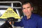 Kalangadoo farmer David Smith stands by his ute, which features a 'lock the gate' sign