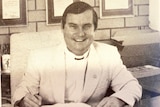 A man in religious clothing in a black-and-white photograph.