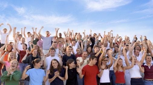 Crowd of youth cheering (Thinkstock: Comstock)