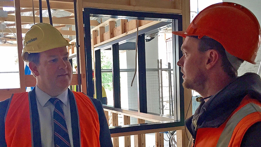 Tasmanian Minister for State Growth Matthew Groom talks with a young construction industry worker