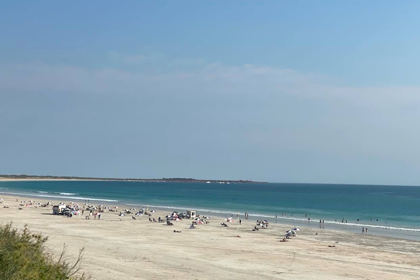 A wide shot of a busy Cable Beach.