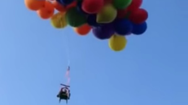 Canadian man Daniel Booria flies on lawn chair strapped with balloons