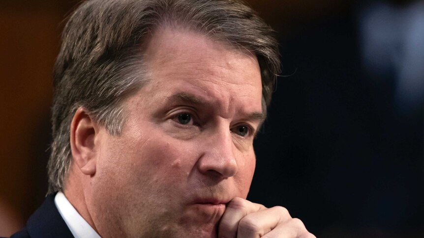 Brett Kavanaugh waits to testify before the Senate Judiciary Committee