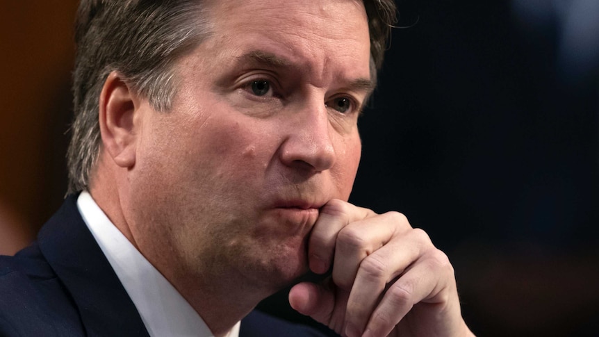 Brett Kavanaugh waits to testify before the Senate Judiciary Committee