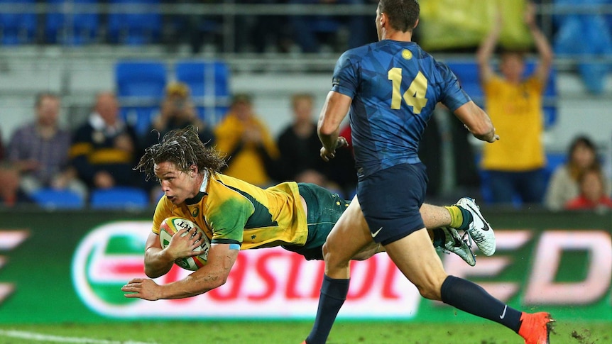 Michael Hooper dives over for a try to the Wallabies against Argentina