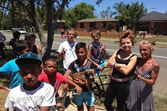 Kids from the western Sydney suburb of Bidwill pose for a photo.