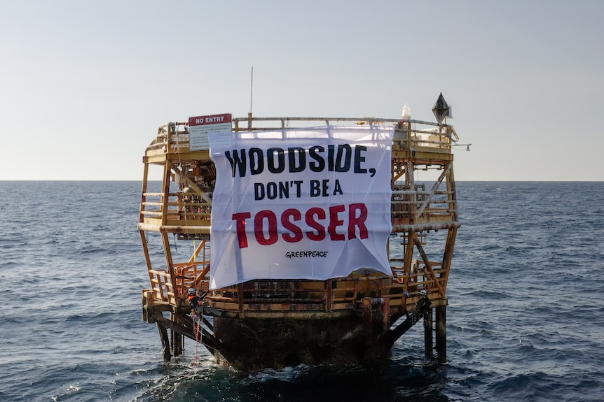 A sign says Woodside, don't be a tosser on a riser turret mooring