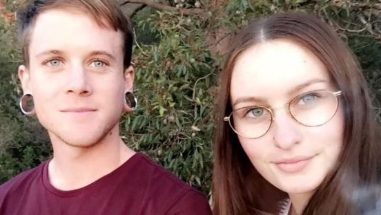 A selfie-style photograph of a young man and woman, both with dark hair.