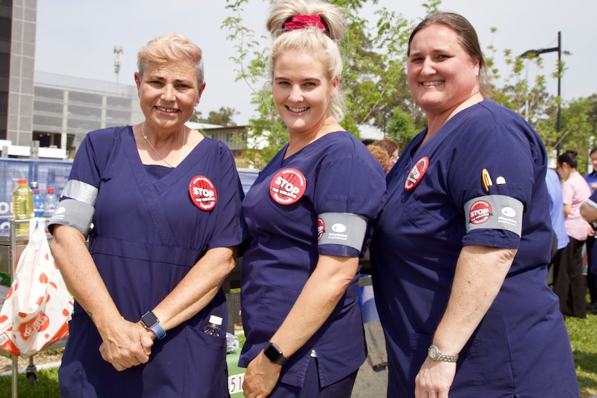 Nurses at Blacktown hospital posing with their Stop Violence  armbands