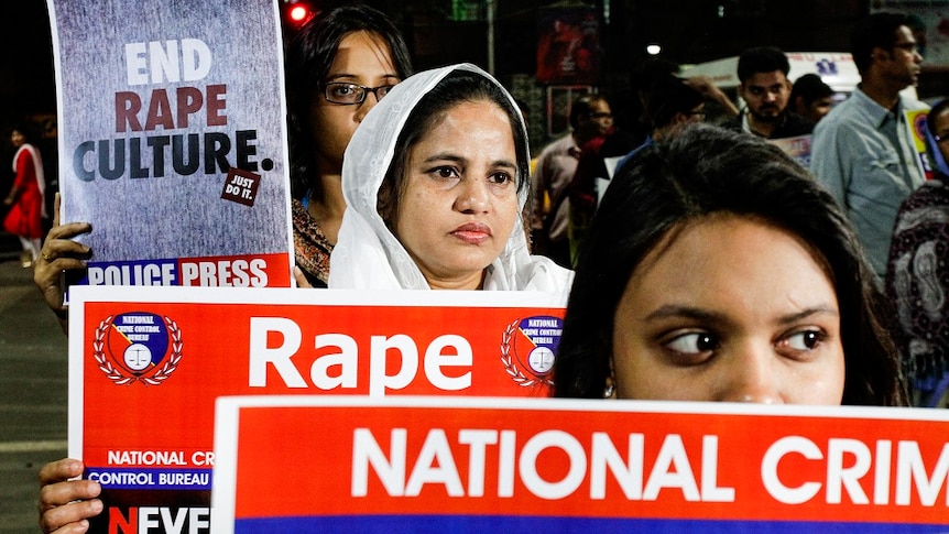 Indians protest against rape holing up posters.