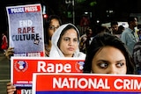 Indians protest against rape holing up posters.