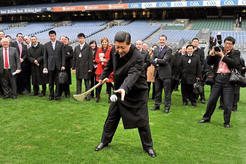Xi Jinping tries his hand at hurling during a visit this year to Croke Park.