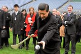 Xi Jinping tries his hand at hurling during his visit to Croke Park.