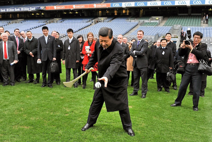 Xi Jinping tries his hand at hurling during his visit to Croke Park.