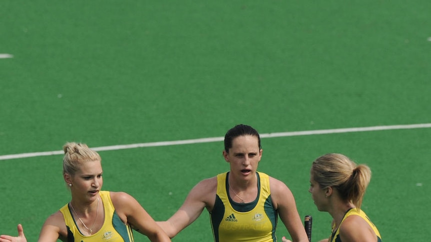Starring role...Kate Hollywood is congratulated on her goal by her Australian team-mates.