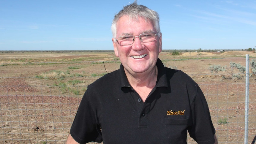 BlazeAid Founder Kevin Butler stands in a paddock near Longreach.