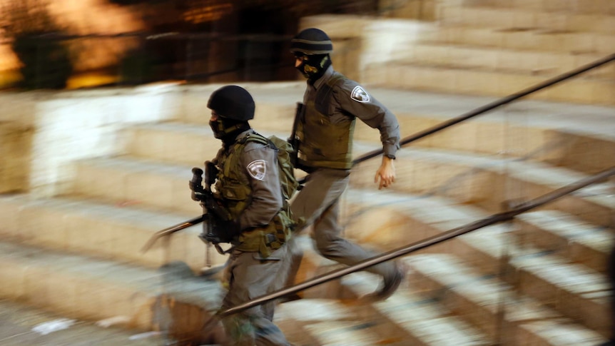 Israeli police run following stabbing attack in Jerusalem