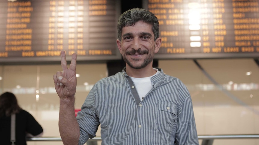 Renas Lelikan smiles at the Melbourne airport