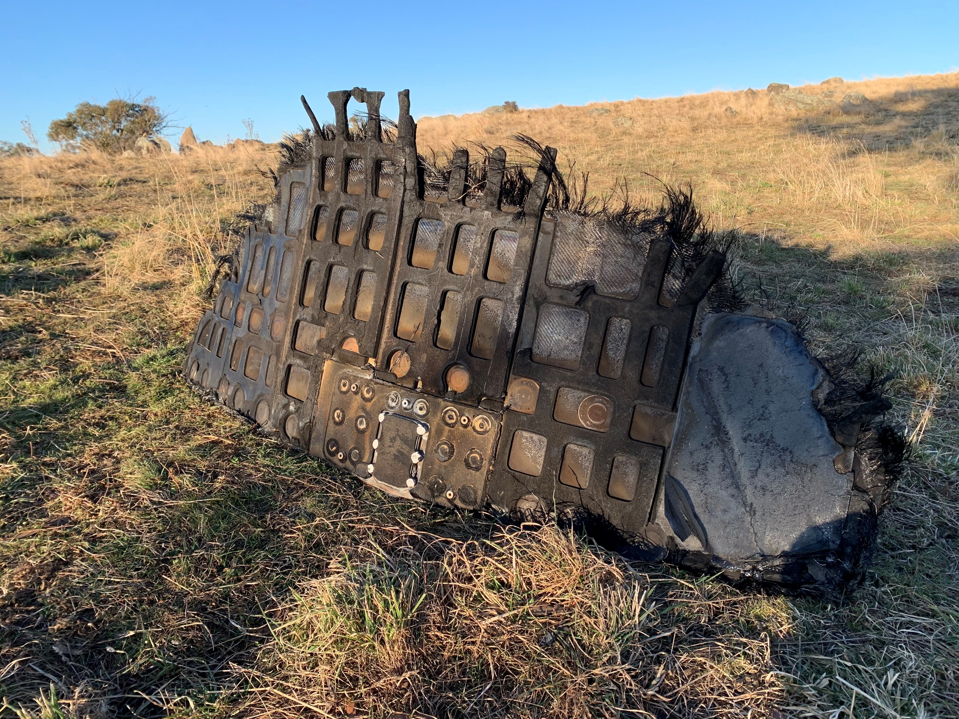 a piece of space junk sitting in a paddock