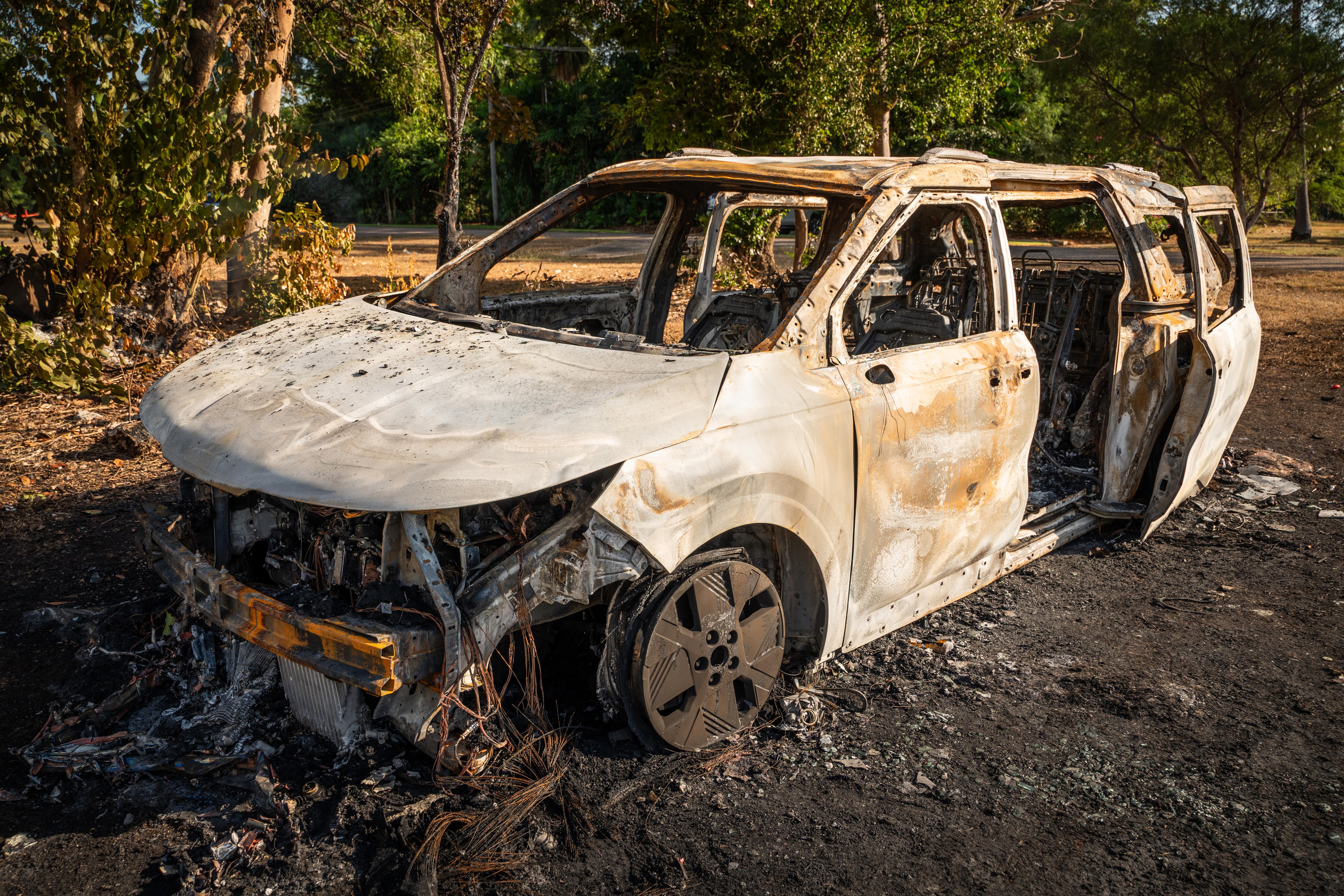 A burnt husk of a car.