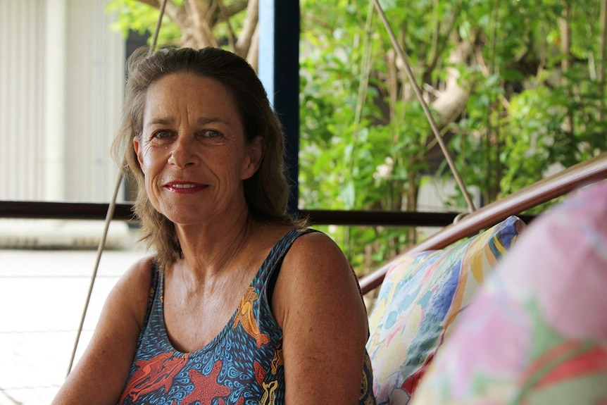 City of Darwin alderman Robin Knox sits on a veranda.