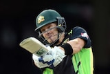 Australia's Shane Watson hits a six off India's Ashish Nehra in T20 international at the SCG.