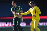 David Miller shakes hands with Marcus Stoinis during the Honart one-day international.