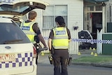 Police outside house at Norlane where woman was stabbed to death