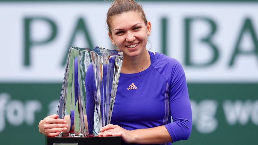 Halep celebrates with Indian Wells trophy