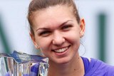 Halep celebrates with Indian Wells trophy