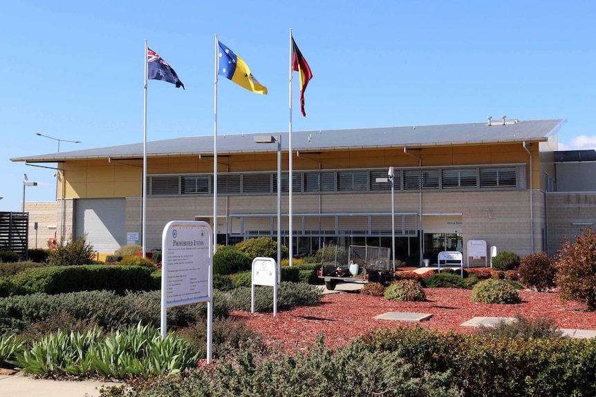 The exterior of the Alexander Maconochie Centre on a sunny day.