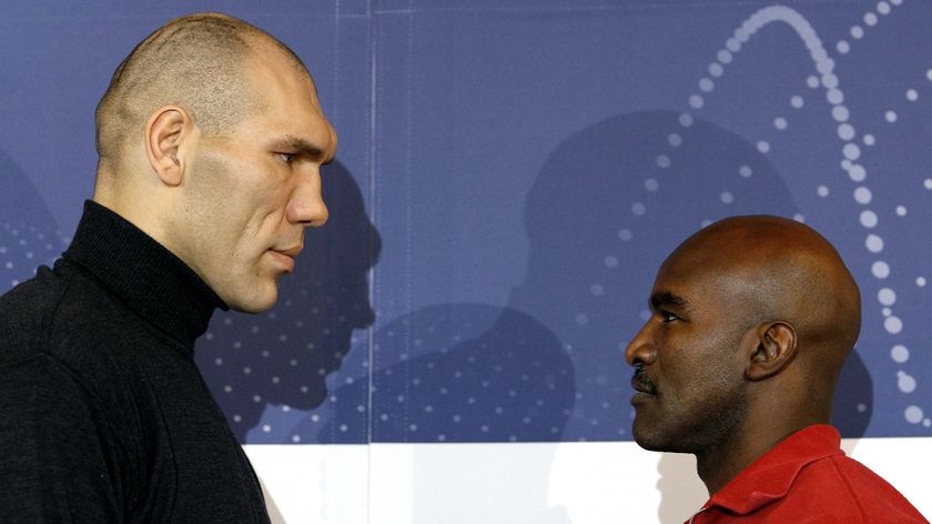 Fight or farce: Man mountain Nikolai Valuyev, standing at 211cm, faces off with Evander Holyfield.
