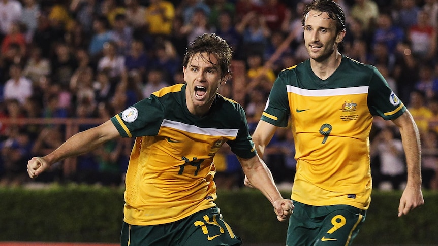 Game-changer ... Brett Holman (L) found the back of the net in the 77th minute.