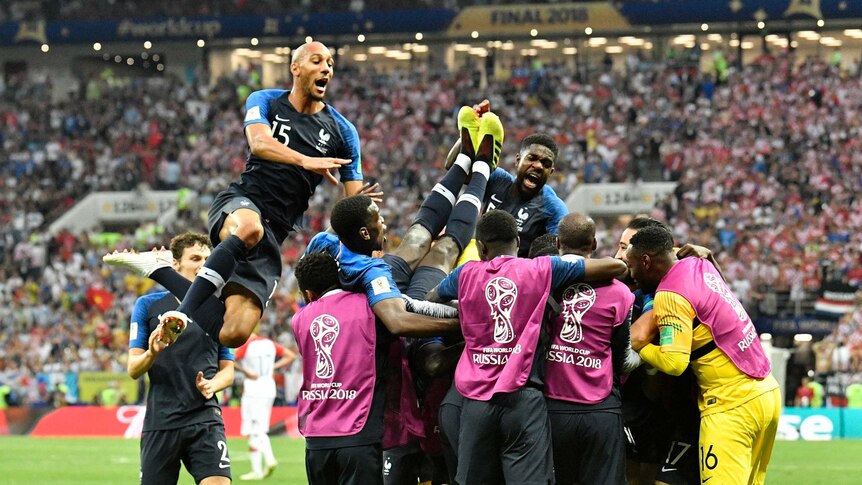 France players jump on top of each other after Kylian Mbappe's goal