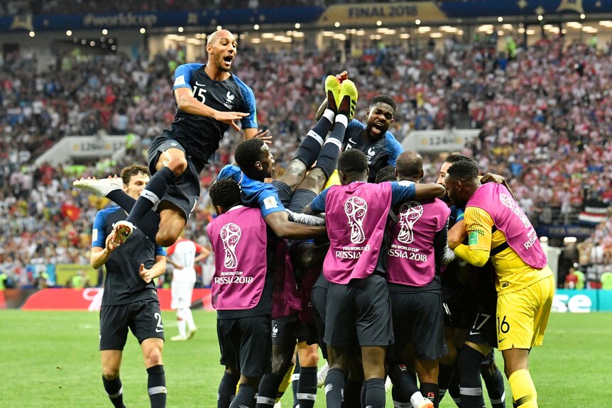 France players jump on top of each other after Kylian Mbappe's goal