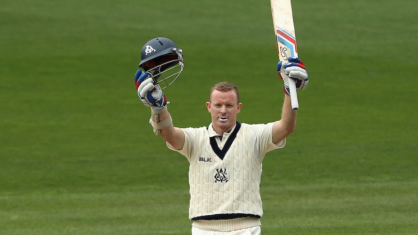 Victorian Chris Rogers celebrates a century against Western Australia in the Sheffield Shield final.
